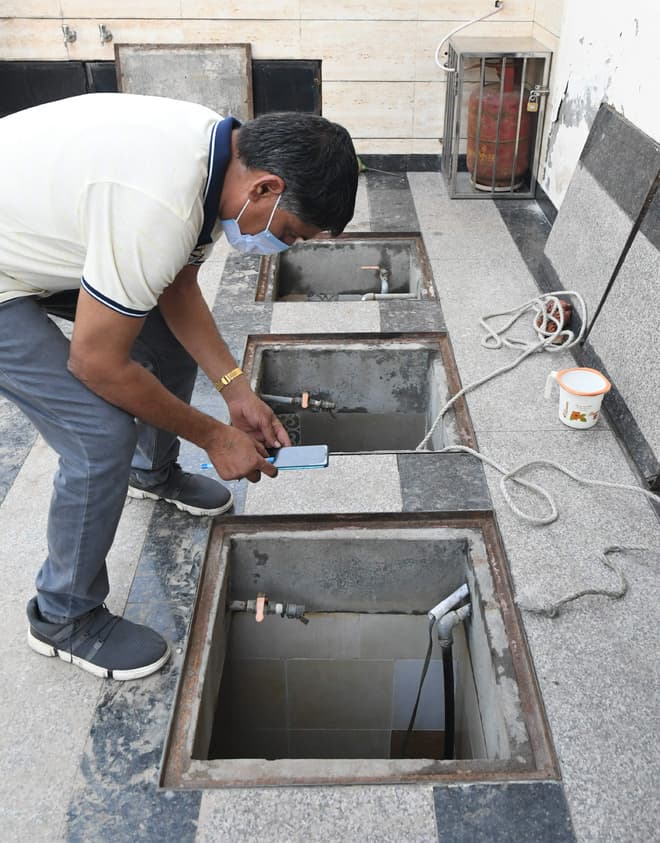 Plumber installing water tank